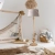 lampa podłogowa drewniana z szarym kloszem boho