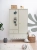 Szafa dwudrzwiowa Babushka oliwkowa w stylu retro, z drążkami, półkami i szufladami. Funkcjonalna i stylowa szafa dziecięca od Wood Luck Design