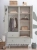 Szafa dwudrzwiowa Babushka oliwkowa w stylu retro, z drążkami, półkami i szufladami. Funkcjonalna i stylowa szafa dziecięca od Wood Luck Design