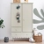 Szafa dwudrzwiowa Babushka oliwkowa w stylu retro, z drążkami, półkami i szufladami. Funkcjonalna i stylowa szafa dziecięca od Wood Luck Design.