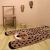 dywan dziecięcy Little Cheetah Gepard 65x125 cm, bawełniany, ręcznie tuftowany, w kolorze karmelowym z czarnymi i beżowymi akcentami, z antypoślizgowym spodem