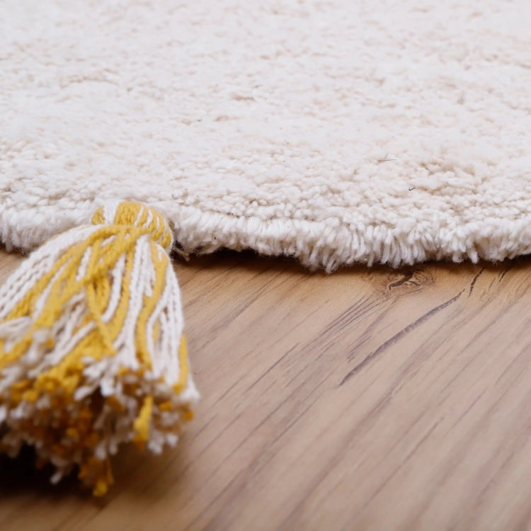 dywan okrągły dziecięcy styl boho z pomponami 110 cm do pokoju malucha