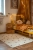 dywan dziecięcy Nümi Amber 100x150 cm, bawełniany, naturalne ecru z bursztynowymi kropkami, miękki, antypoślizgowy, do prania w pralce