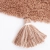 dywan dziecięcy okrągły brązowo różowy bawełniany 110 cm styl boho z pomponami do pokoju dziewczynki